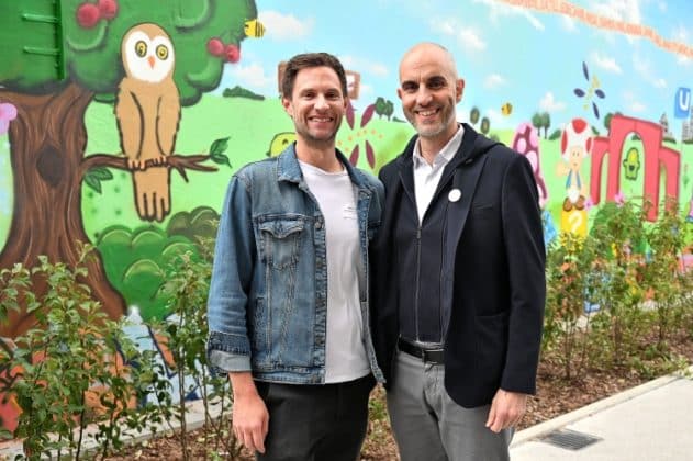 two men standing next to each other